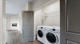 A washer and dryer are included in the 2 bedroom Marigold with den floor plan at WH Flats