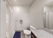 Thumbnail 11 of 11 - a bathroom with a toilet sink and shower
