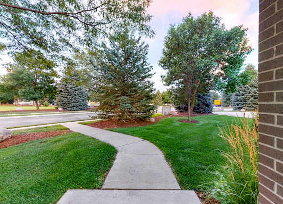 You'll love manicured landscape view from your private entrance of this two bedroom Cedar floor plan.