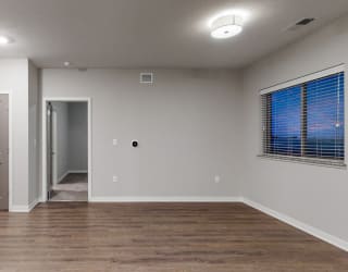The 2 bedroom Hibiscus floor plan at WH Flats features natural light and a spacious living and dining area.