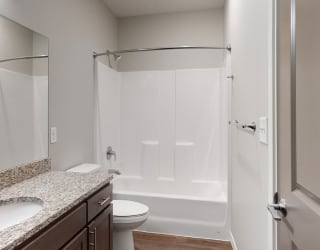 The 2 bedroom Hibiscus floor plan features a spacious bathroom with granite vanity top and a tub/shower.