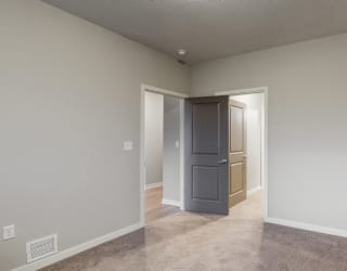 The bedrooms in the Hibiscus floor plan feature spacious walk-in closets.