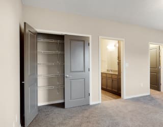 The master bedroom in the Marigold with den floor plan features spacious and abundant storage.