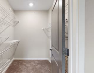 You'll love the large walk-in closet in the master bedroom of the Marigold with den floor plan at WH Flats.