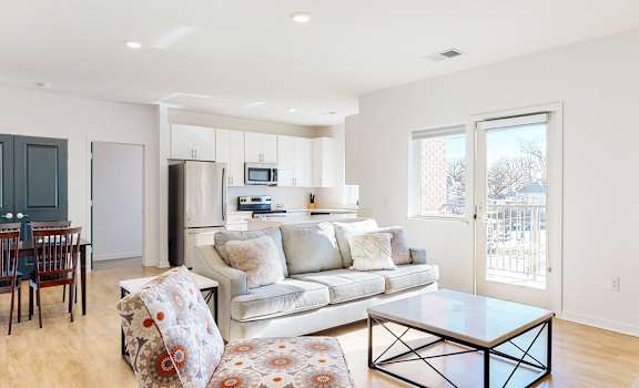 a living room with a couch and a table