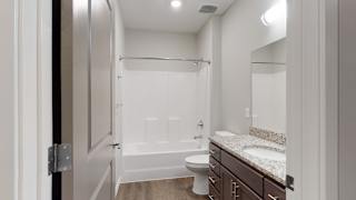 The 2 bedroom Hibiscus floor plan features a spacious bathroom with granite vanity top and a tub/shower.
