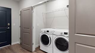 A washer and dryer are included in the 2 bedroom Hibiscus floor plan at WH Flats