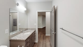 The 2 bedroom Hibiscus floor plan features a spacious bathroom with granite vanity top and a tub/shower.