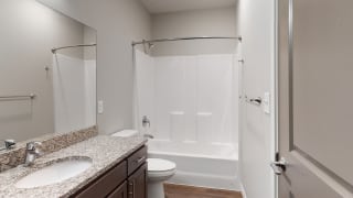 The 2 bedroom Hibiscus floor plan features a spacious bathroom with granite vanity top and a tub/shower. The 2 bedroom Hibiscus floor plan features a spacious bathroom with granite vanity top and a tub/shower.