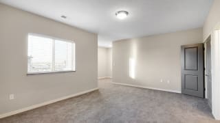 The large bedroom with den area in the 2 bedroom Marigold with den floor plan is perfect for a desk or reading nook.