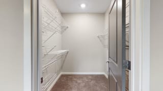 You&#x27;ll love the large walk-in closet in the master bedroom of the Marigold with den floor plan at WH Flats.