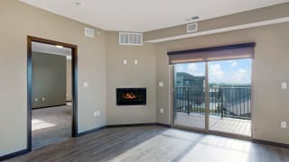 The 2 bedroom Snowdrop with den floor plan at WH Flats features natural light and a spacious dining and living area with electric fireplace. The 2 bedroom Snowdrop with den floor plan at WH Flats features natural light and a spacious dining and living area with electric fireplace.