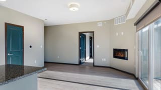 The 2 bedroom Snowdrop with den floor plan at WH Flats features natural light and a spacious dining and living area with electric fireplace. The 2 bedroom Snowdrop with den floor plan at WH Flats features natural light and a spacious dining and living area with electric fireplace.