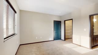 You&#x27;ll love the large walk-in closet in the master bedroom of the Snowdrop with den floor plan at WH Flats.