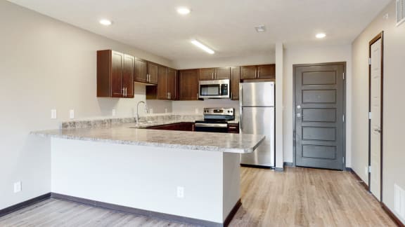 Renovated kitchen with large peninsula island with ample storage at Northridge Heights