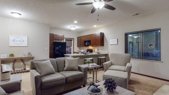 The spacious kitchen overlooks the living space in the 2 bedroom Cedar floor plan.