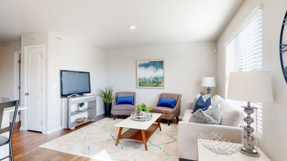 a living room with a couch and a tv