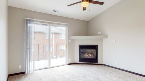 Renovated corner gas fireplace in living room at Northridge Heights