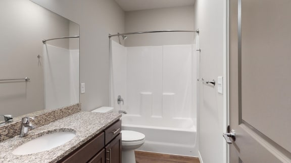The 2 bedroom Hibiscus floor plan features a spacious bathroom with granite vanity top and a tub/shower.
