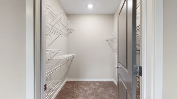 You'll love the large walk-in closet in the master bedroom of the Marigold with den floor plan at WH Flats.