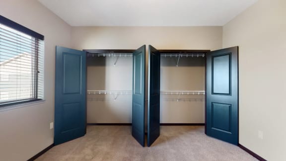 The 2 bedroom Snowdrop with den floor plan features spacious closets with abundant storage.