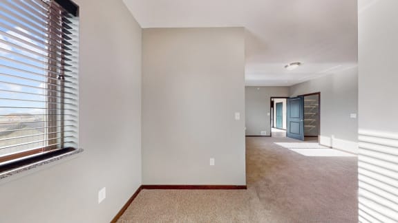 The large bedroom with den area in the 2 bedroom Snowdrop with den floor plan is perfect for a desk or reading nook.