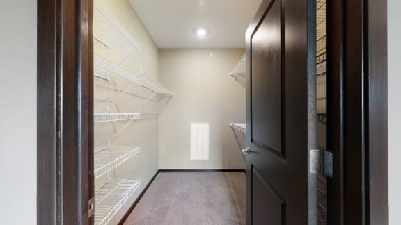 You'll love the large walk-in closet in the master bedroom of the Snowdrop with den floor plan at WH Flats.