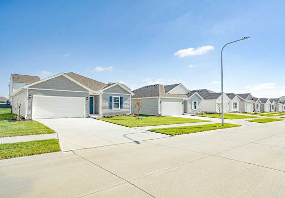 a row of houses on the side of a street