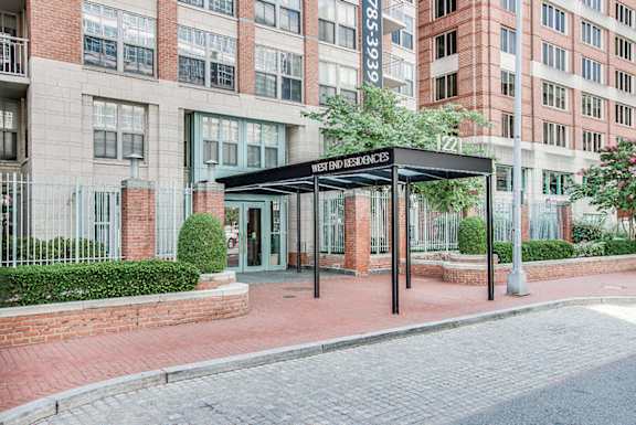 The front of a building with a sign that says "Residential".