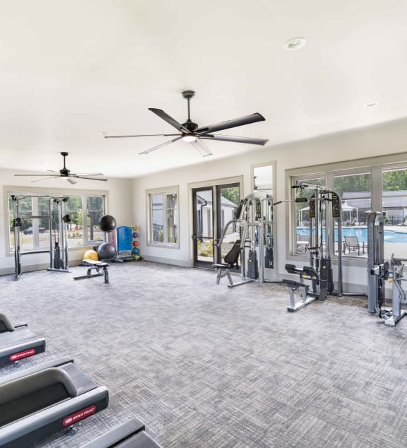 a group of people working out in a gym with weights