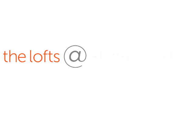 A green background with the words "the lofts @ elk terminal" written in white.