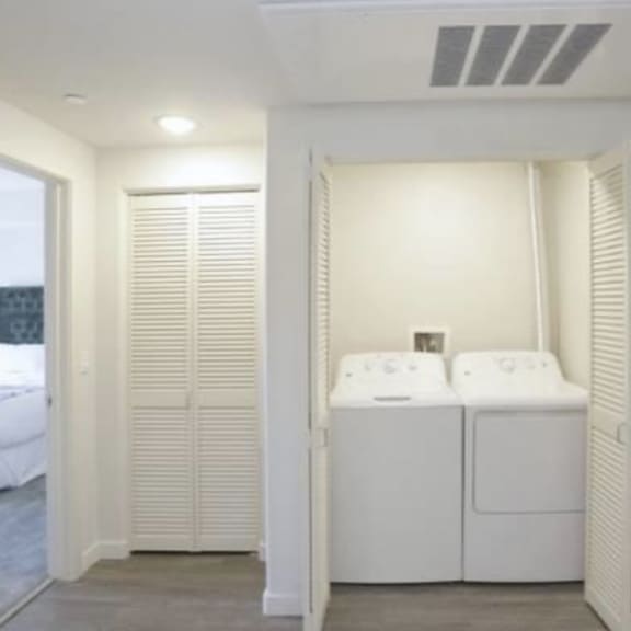 a room with a washer and dryer in it