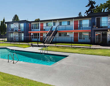 our apartments have a swimming pool and a patio with chairs