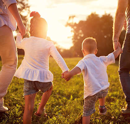 Family walking in the grass at Eagles Landing, Florida