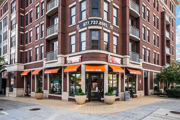 a brick building with an orange awning