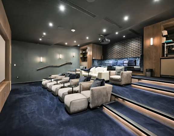 A gym with a variety of equipment including treadmills, stationary bikes, and weight machines.