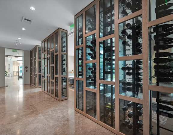 A gym with a variety of equipment including treadmills, stationary bikes, and weight machines.