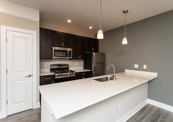 The Ervin Kitchen with Quartz Countertops  at The Flats on Houk, Delaware