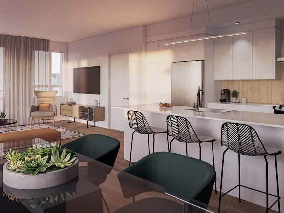 A modern kitchen with a dining table and chairs.