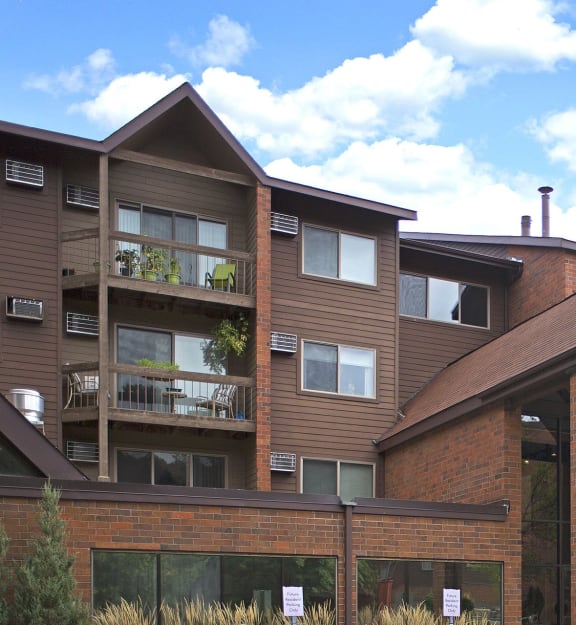 the exterior of a condo building with a balcony  at Park Pointe, St. Louis Park, Minnesota