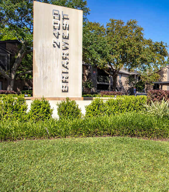A sign that says "2200 E. Ridgewood" stands in front of a building.