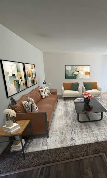 A living room with a brown couch, a coffee table, and a flat screen TV.