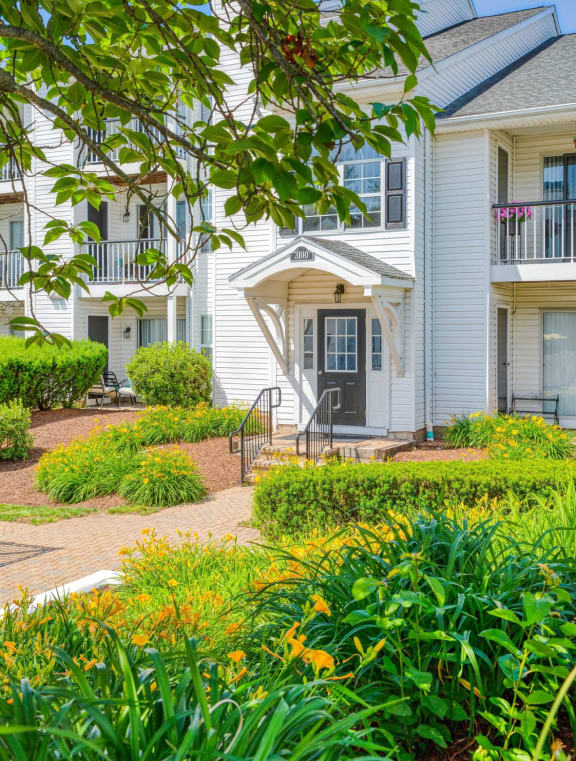 a view of a building with a garden in front of it  at Middletown Ridge Apartments, Middletown, Connecticut