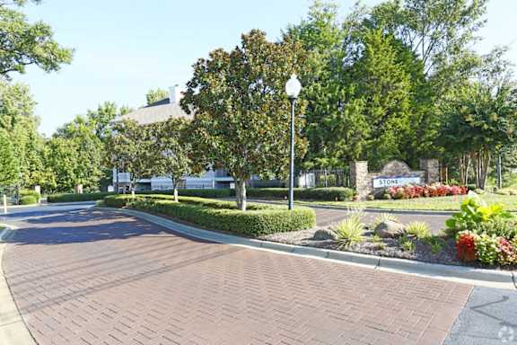 A curved driveway leads to a building with a sign that says "STORE".