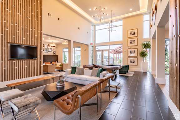 A modern living room with a wooden wall panel and a flat screen TV.