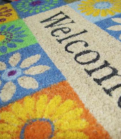 a rug with the word welcome on it at Brookwood at Oakdale 55+, New York, 11769