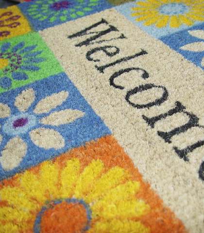 Colorful doormat with a welcome sign at Brookwood at Bay Shore in Bay Shore, NY 11706