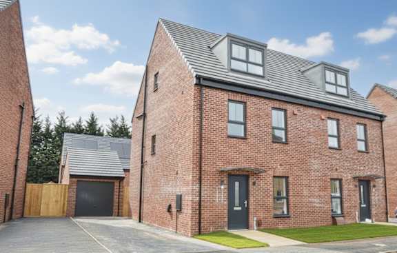 A red brick house with a black door and windows.