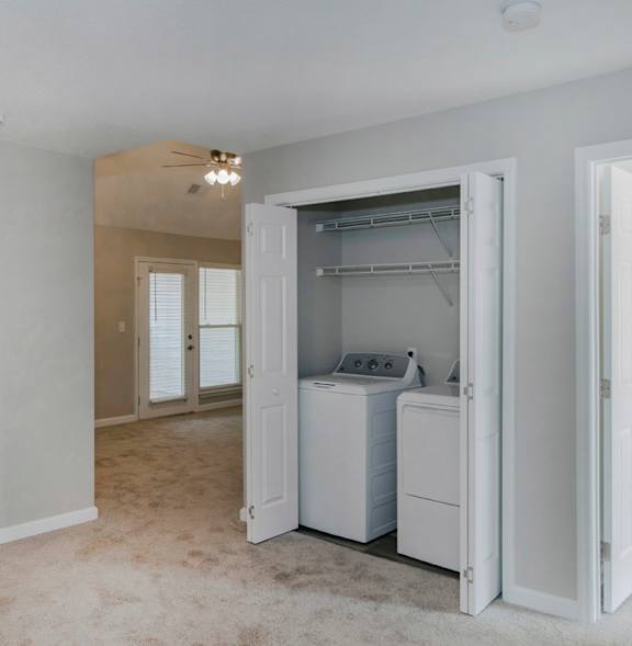 A laundry room with a washer and dryer in it.
