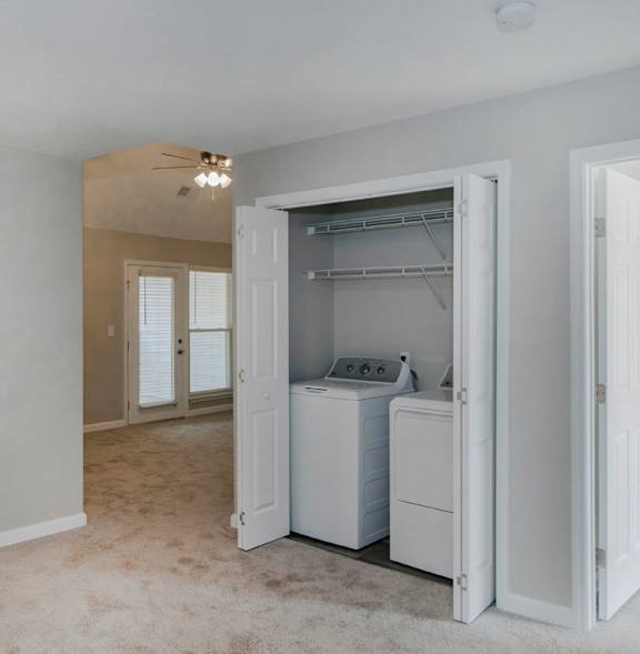 A laundry room with a washer and dryer in it.